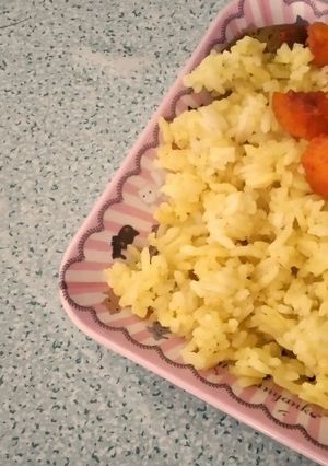 A picture of Nasi Kuning / Turmeric Rice.