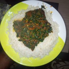 A picture of Vegetable soup and rice.