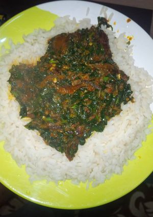 A picture of Vegetable soup and rice.