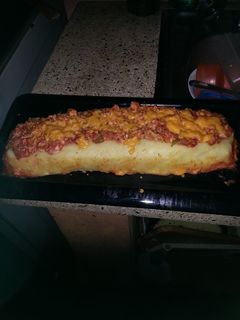 Una foto de Brazo gitano de papa relleno de pollo