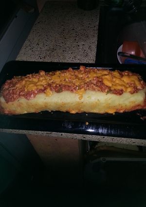 Una foto de Brazo gitano de papa relleno de pollo