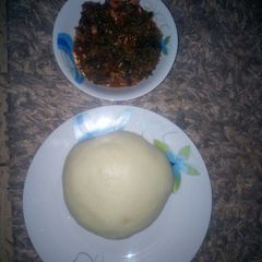 A picture of Vegetable soup and pounded yam.