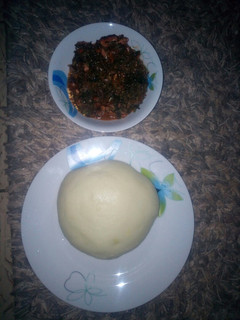 A picture of Vegetable soup and pounded yam.