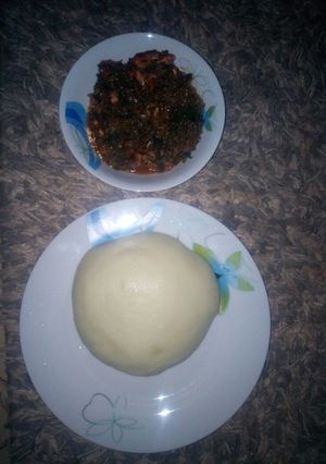 A picture of Vegetable soup and pounded yam.