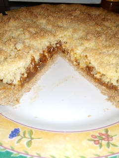 Una foto de Tarta integral de coco y dulce de leche