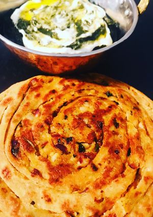 A picture of Potato masala stuffed lachha paratha.