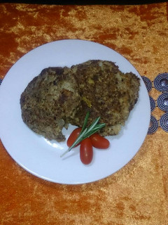 A picture of Brown bread crusted fish cakes.