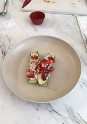 A picture of Cucumber hummus boat.