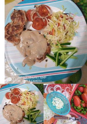 A picture of Chicken Steak with Mushroom Olive Sauce.