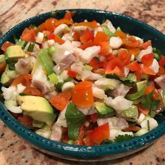 Ceviche with avocado, cherry tomatoes and spring onions A picture of Ceviche with avocado, cherry tomatoes and spring onions.