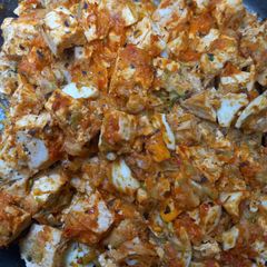 A picture of Zucchini with Smoked Tofu and Boiled Eggs in Ajvar Sauce.