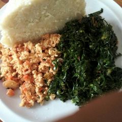 A picture of Fried eggs +Fried kale.