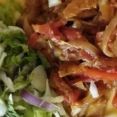 Shredded chicken sauce and lettuce salad A picture of Shredded chicken sauce and lettuce salad.