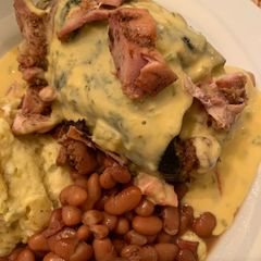 Poblano Pepper Stuffed with Grilled Chicken Covered with Queso A picture of Poblano Pepper Stuffed with Grilled Chicken Covered with Queso.