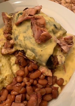 A picture of Poblano Pepper Stuffed with Grilled Chicken Covered with Queso.