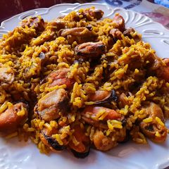 A picture of Brown rice with mushrooms and mussels.