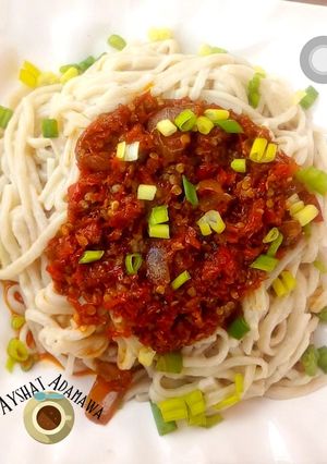 A picture of Hand made pasta with sauce.