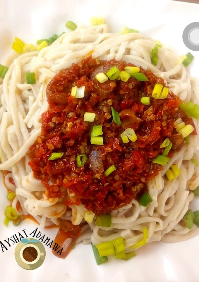 A picture of Hand made pasta with sauce.
