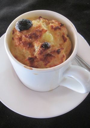 A picture of Bread And Banana Tea Cup Pudding.