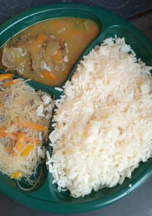 A picture of Boiled rice and chicken sauce and pasta.