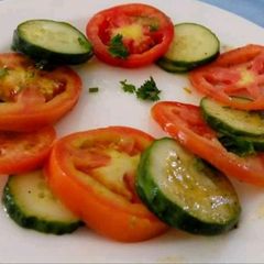 A picture of Tomato 🍅 Cucumber 🥒 Salad.