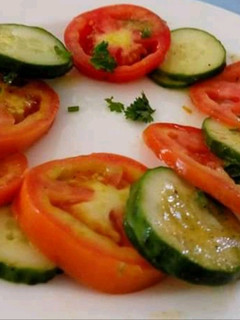 A picture of Tomato 🍅 Cucumber 🥒 Salad.