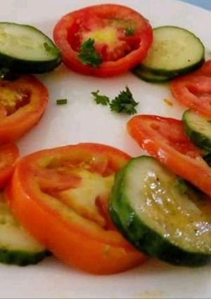 A picture of Tomato 🍅 Cucumber 🥒 Salad.