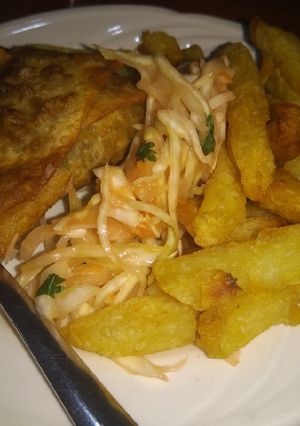 A picture of Chips served with samosa.