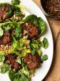 Thai-spiced rice fritter salad with herbs and soy, lime and chilli dressing