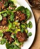Thai-spiced rice fritter salad with herbs and soy, lime and chilli dressing
