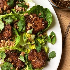 Thai-spiced rice fritter salad with herbs and soy, lime and chilli dressing A picture of Thai-spiced rice fritter salad with herbs and soy, lime and chilli dressing.