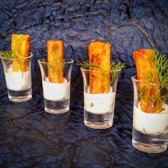 A picture of Crispy turmeric panisse with dill and yogurt dip.