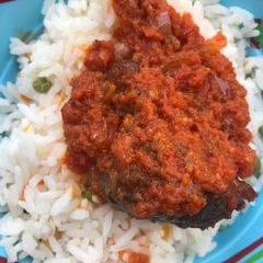 A picture of Stew and rice.