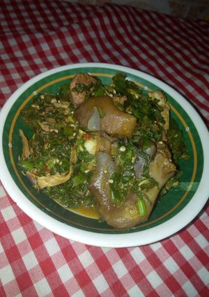 A picture of Okro soup with melon leaves.