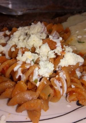Una foto de Fusilli entomatado con queso