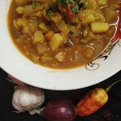 A picture of Dry fish curry with mix veg.