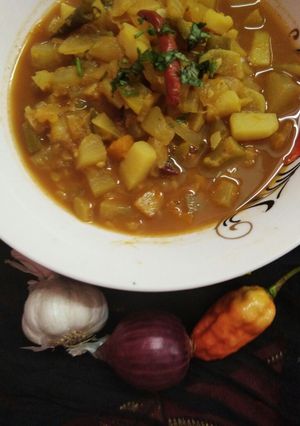 A picture of Dry fish curry with mix veg.