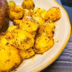 A picture of Crispy Garlic and Herb Air-fryer Potatoes.