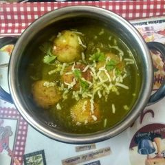 A picture of Spinach paneer kofta with cheese.