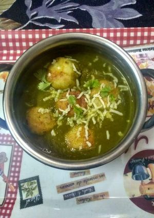 A picture of Spinach paneer kofta with cheese.