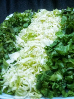 A picture of Lettuce and cabbage salad.