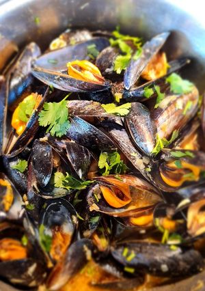 A picture of Mussels in a Thai broth.