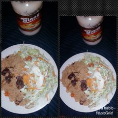 Jallof rice with salad A picture of Jallof rice with salad.