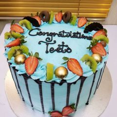 A picture of Chocolate cake with strewberry toppings.