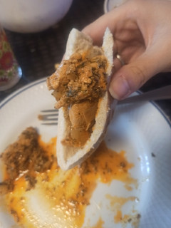 Una foto de Relleno de pan de pita. Pollo al estilo gyros
