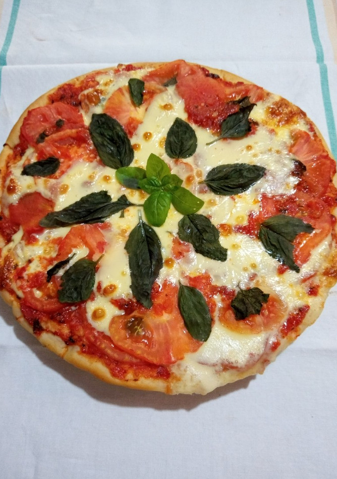 Una foto de Pizza de tomates 🍅🍅