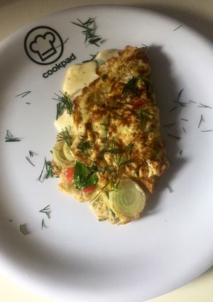 A picture of Cheese omelet with vegetables.