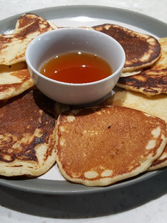 A picture of Scotch Pancakes with Warm Maple Syrup.