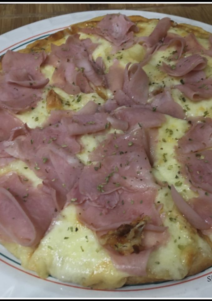 Una foto de Pizza prosciutto