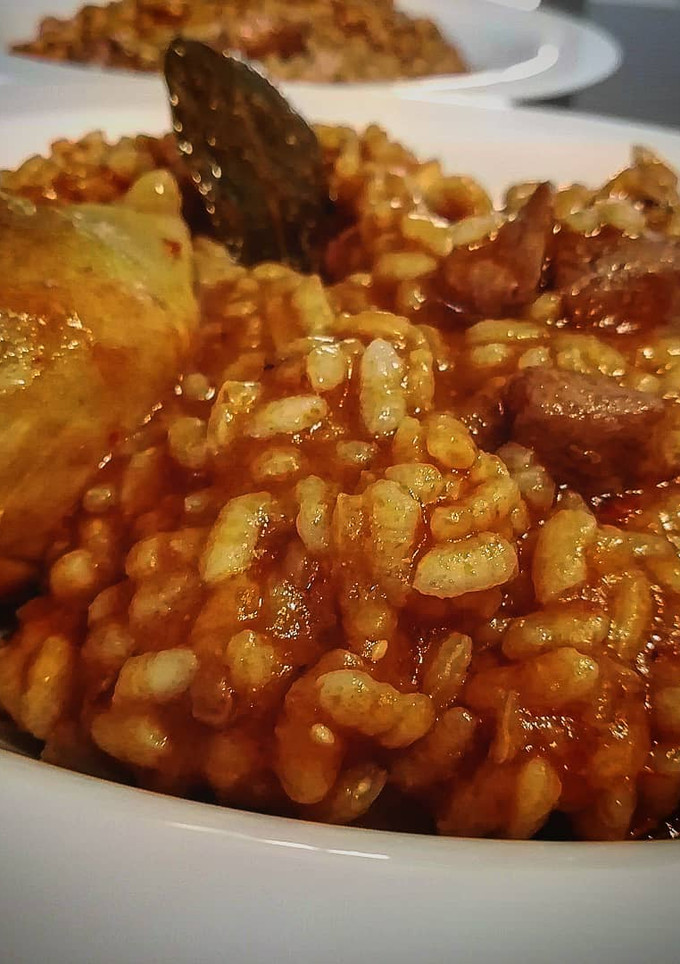Una foto de Arroz meloso con pollo